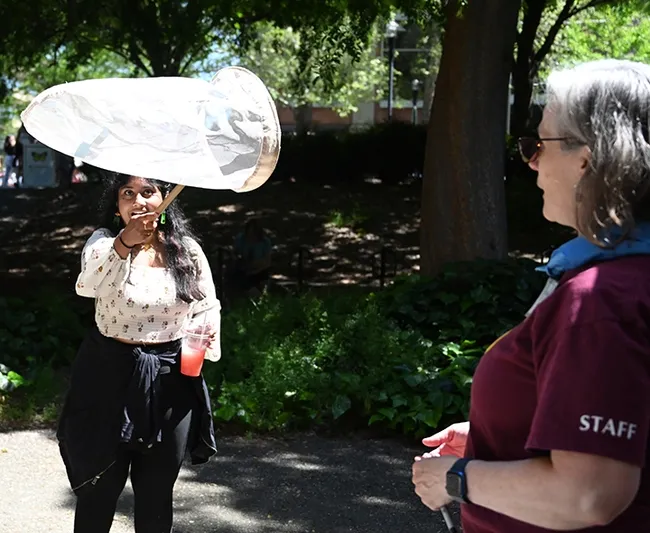 It's a catch! UC Davis undergraduate student Lasya Nalia, majoring in environmental horticulture, nets a paper butterfly tossed by Professor Fran Keller of Folsom Lake College, a Bohart Museum scientist and UC Davis doctoral alumna. (Photo by Kathy Keatley Garvey)