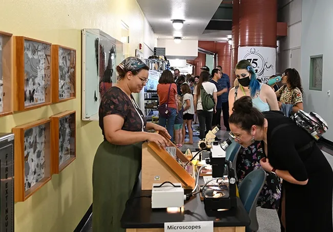 Iris Quayle of the laboratory of Jason Bond, director of the Bohart Museum, explains the differences between moths and butterflies. (Photo by Kathy Keatley Garvey)