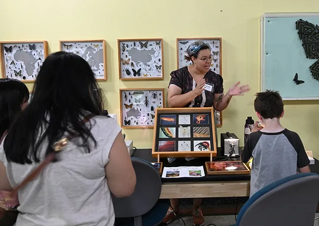 UC Davis doctoral candidate Iris Quayle answering questions from the visitors at the Bohart Museum open house. (Photo by Kathy Keatley Garvey)