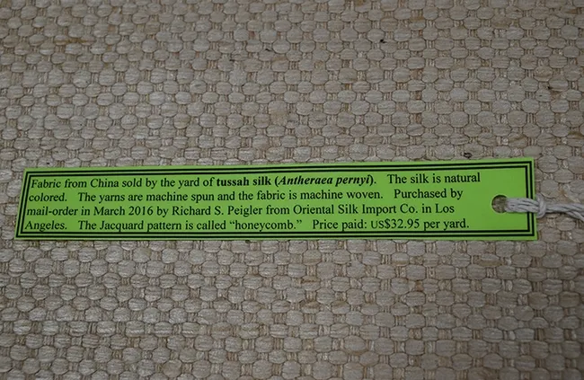 This is tussah silk fabric in a pattern called "Honeycomb." Donor Richard Pleiger purchased this fabric from a Los Angeles company for $32.95 per yard. There are several species of tussah silk moths (family Saturniidae) in China, India, Japan, Africa and North America.(Photo by Kathy Keatley Garvey)
