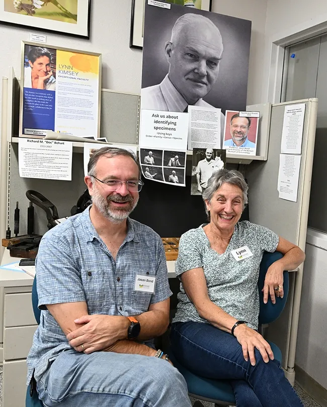 Only three directors have led the Bohart Museum of Entomology since 1946. Pictured are hymenopterist Lynn Kimsey, director from 1990 to Feb. 1, 2024, and arachnologist Jason Bond, director since Feb. 1. The portrait shows Richard "Doc" Bohart, who founded the insect museum in 1946. (Photo by Kathy Keatley Garvey)
