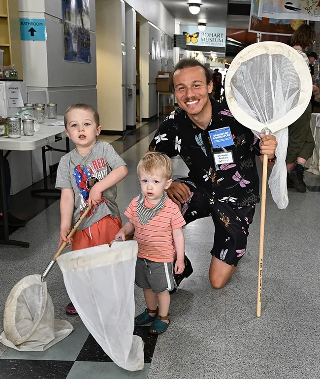 Future entomologists? The Nguyen brothers of Davis--Branden, 3, and Owen, 18 months old--pose with UC Davis doctoral candidate Christofer Brothers. (Photo by Kathy Keatley Garvey)