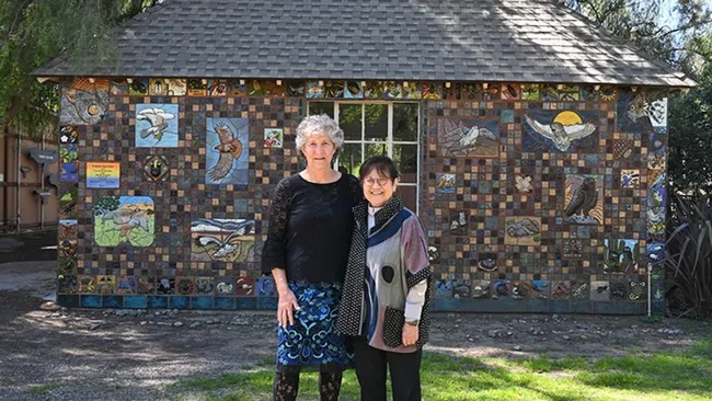 UC Davis distinguished professor emerita Diane Ullman of the Department of Entomology and Nematology and Gale Okumura, Department of Design faculty emerita, in front of "A Bird's Eye View." (Photo by Kathy Keatley Garvey)