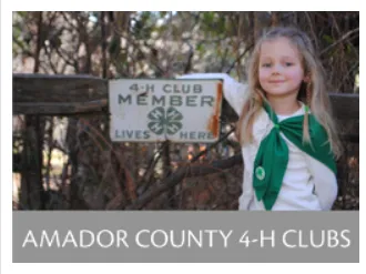 Amador 4-H child with historic 4-H sign