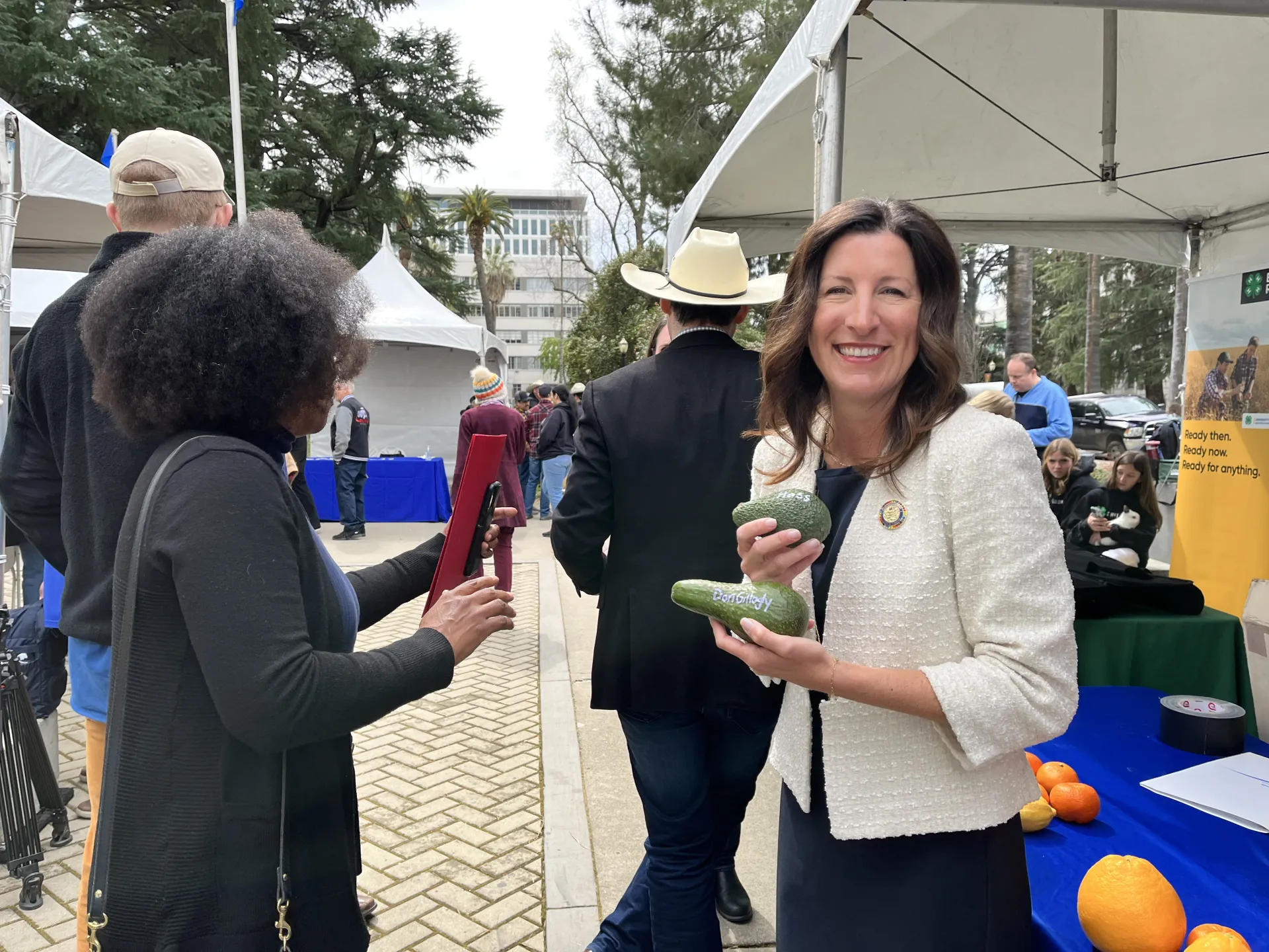 Cottie Petrie-Norris holds a large avocado