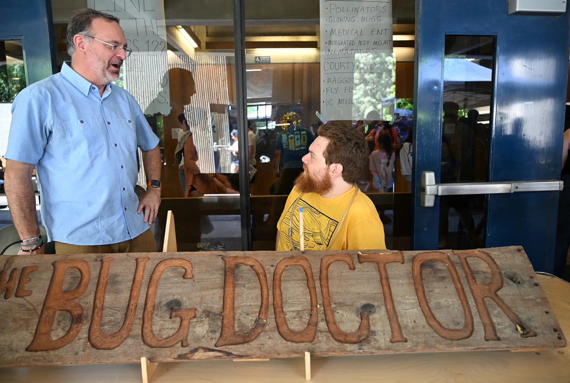 Professor Jason Bond conversing with doctoral candidate Ziv Lieberman. (Photo by Kathy Keatley Garvey)