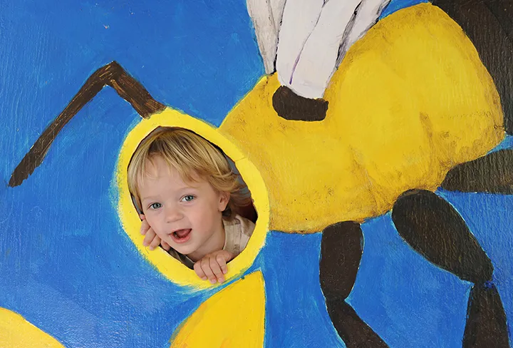 Alex, then almost three, smiles as he pretends to be a bee at a UC Davis Picnic Day. (Photo by Kathy Keatley Garvey)