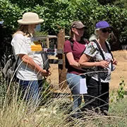workshop participants in the demonstration garden