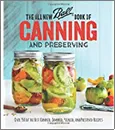 Cover page of the Ball book of Canning and Preserving with two jars full of red and green tomatoes.