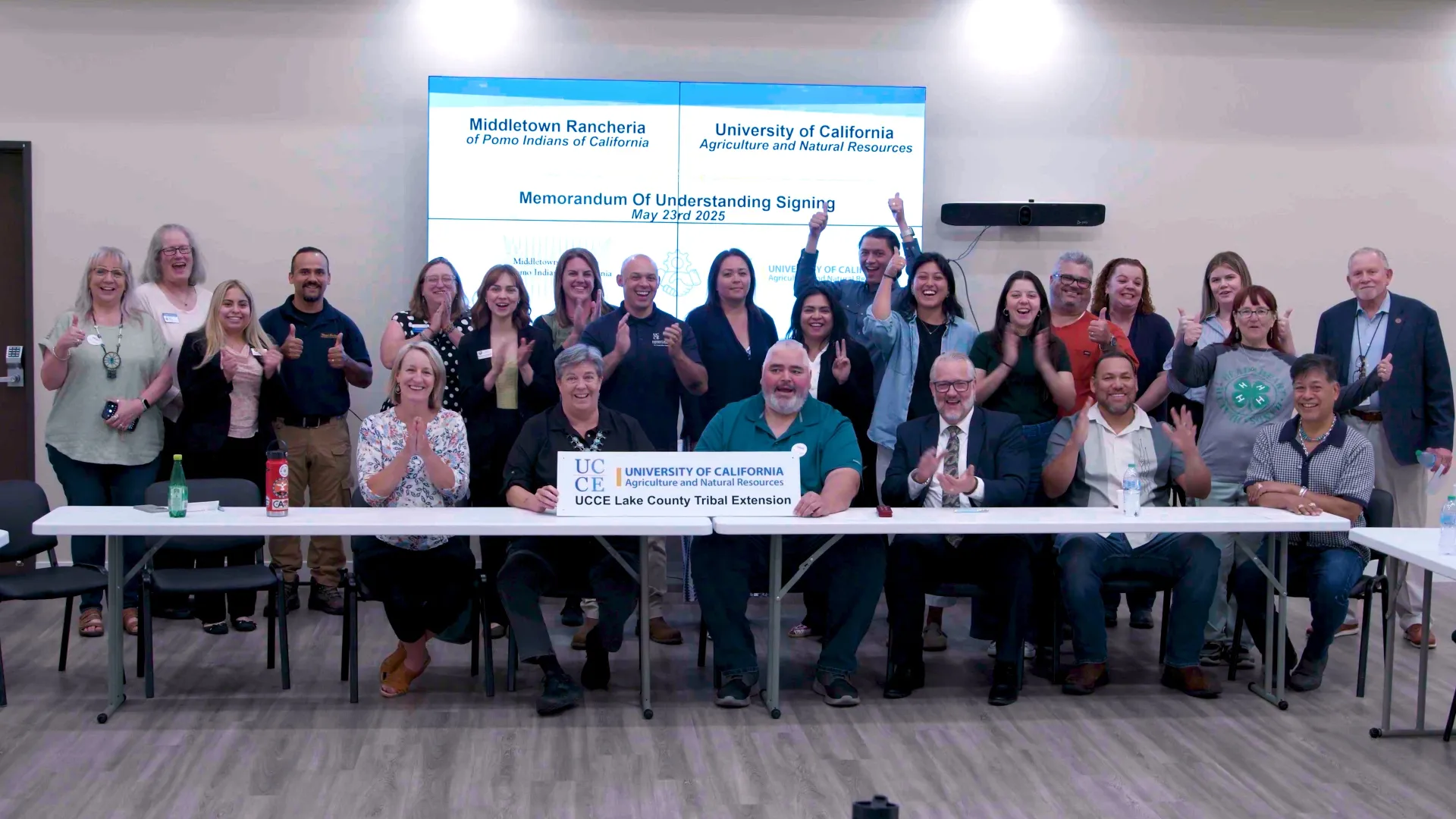 UC ANR teams, Middletown Rancheria leaders and county officials pose to celebrate MOU signing