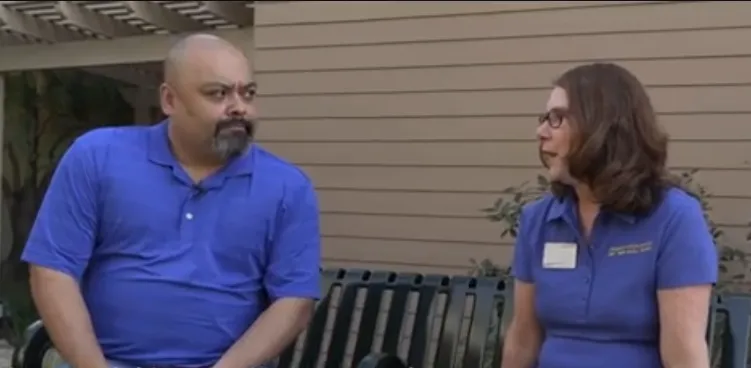 Art and Lori sit on a park bench talking