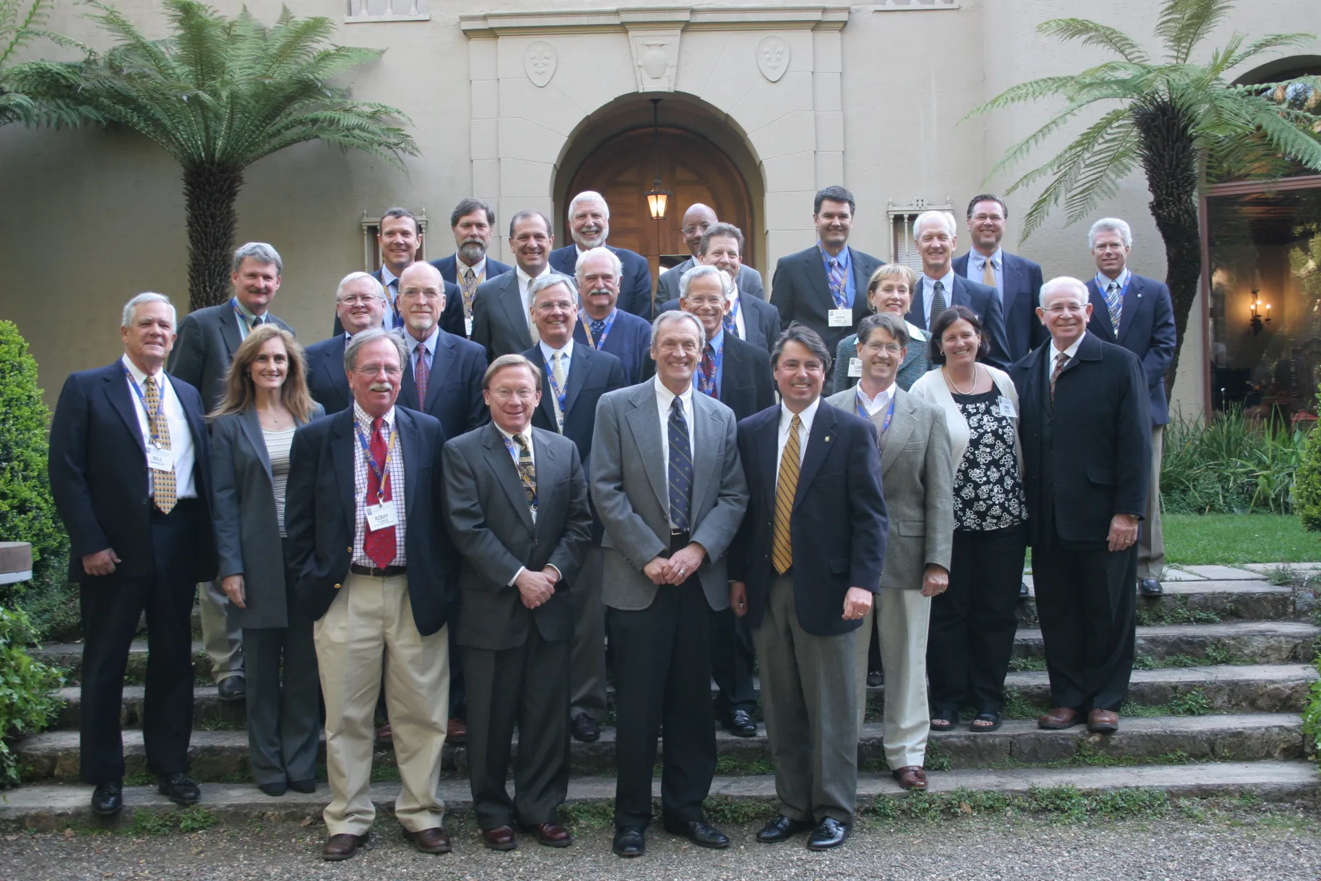 A group of people stand in front of Blake House