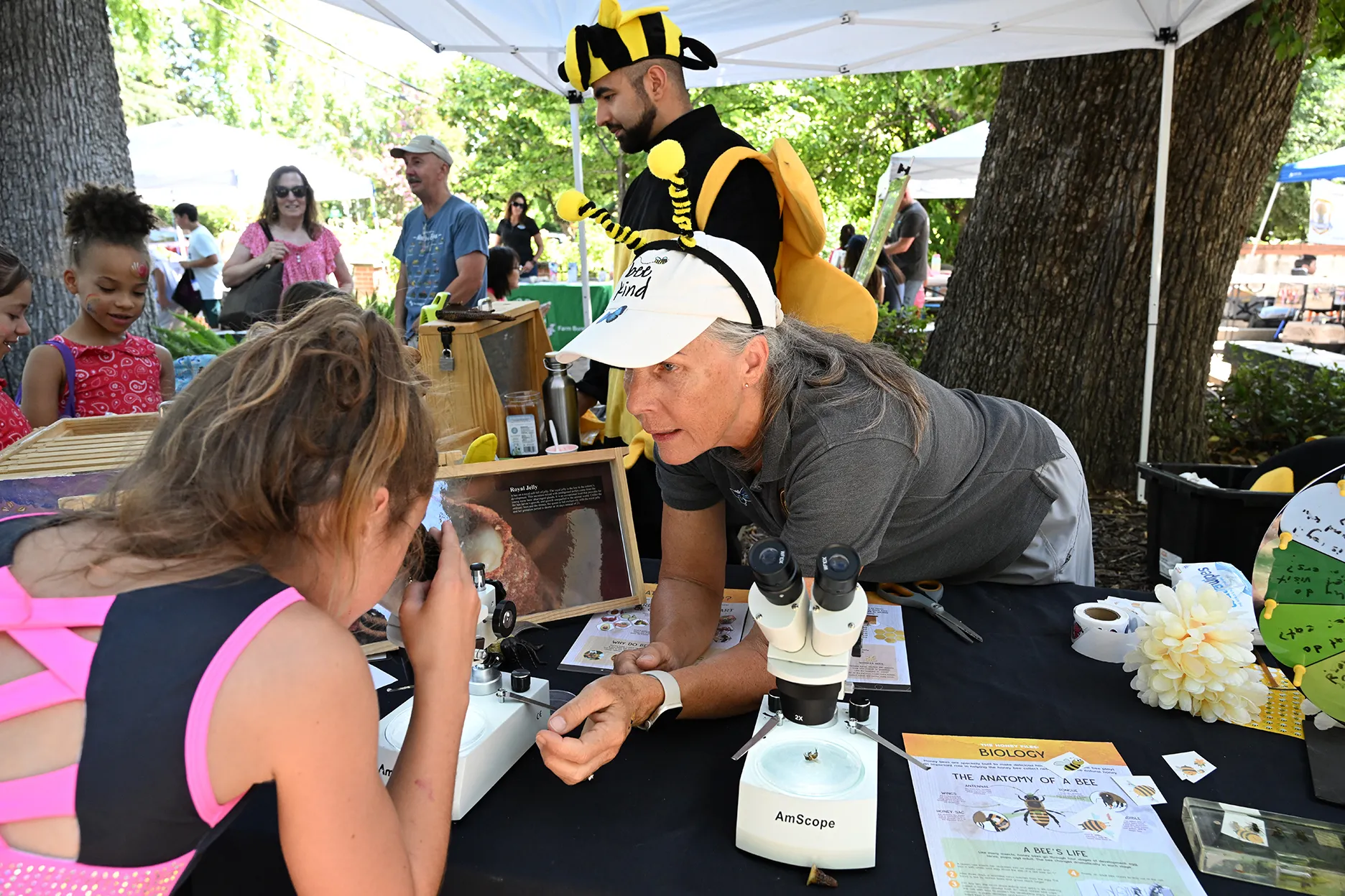 Wendy Mather (foreground) and Kian Nikzad (background), co-program managers of CAMBP, talk to the crowd. (Photo by Kathy Keatley Garvey)