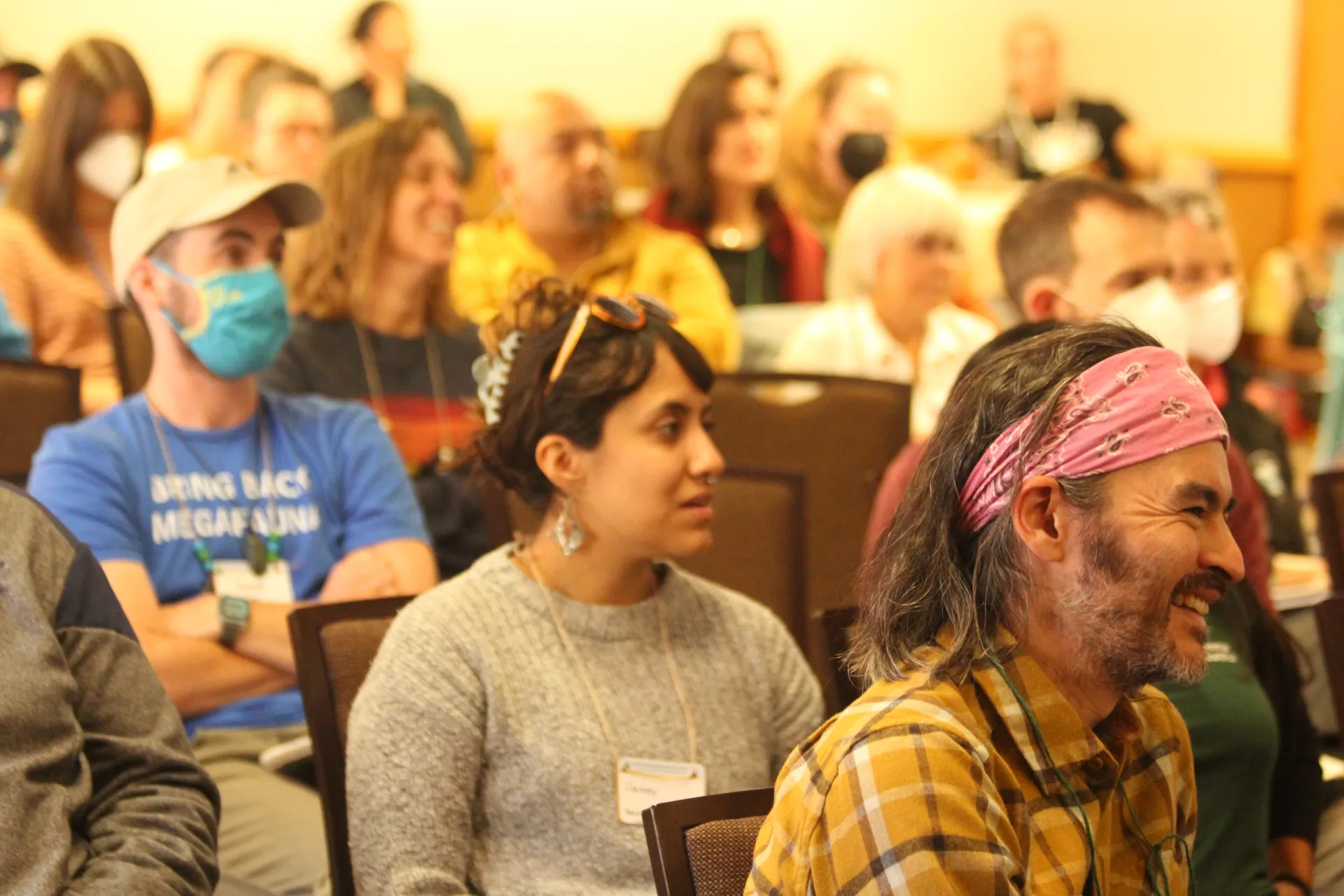people laughing at a presentation at the 2022 statewide conference