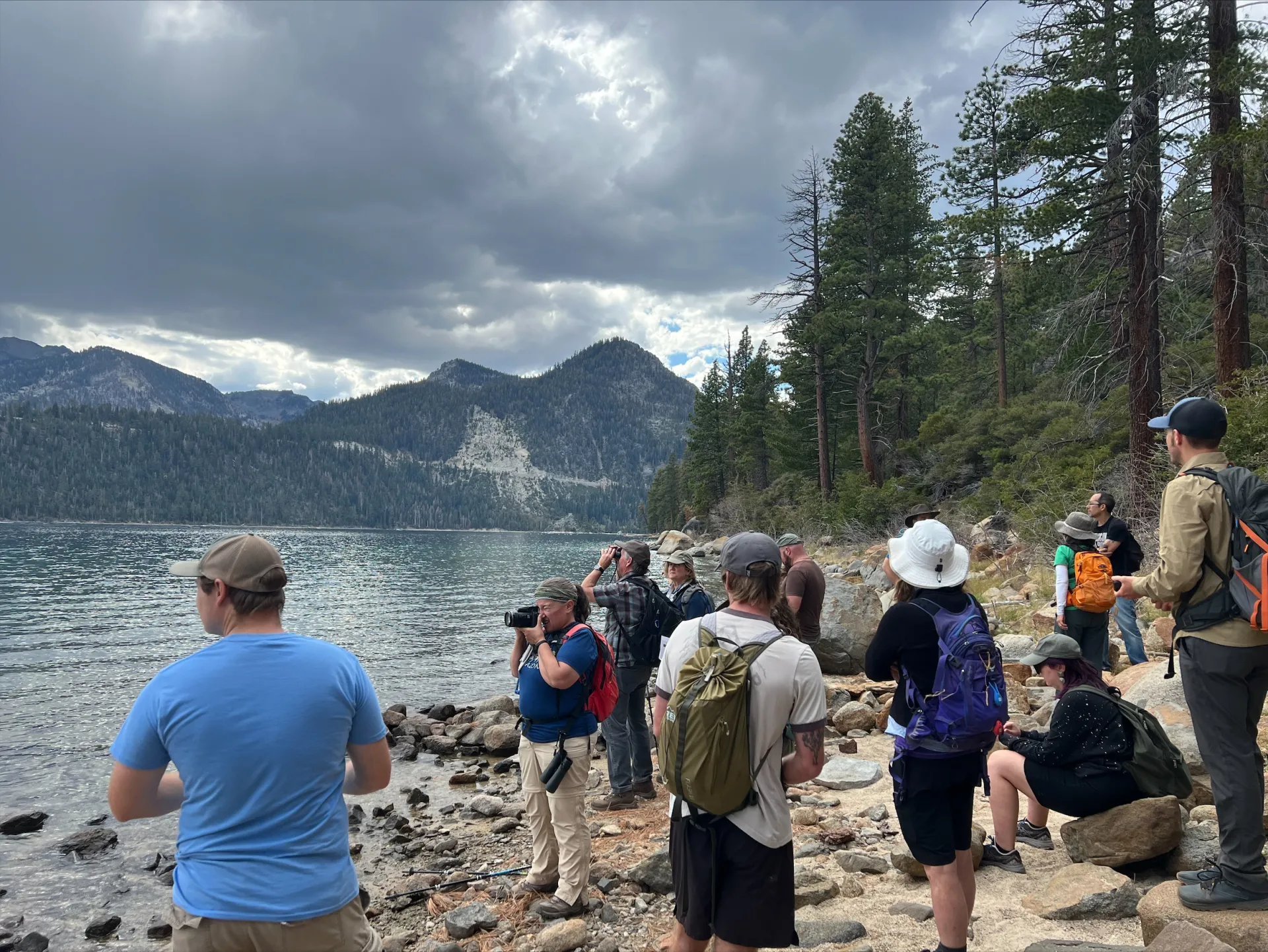 people take photos while out on a hike at the 2022 statewide conference