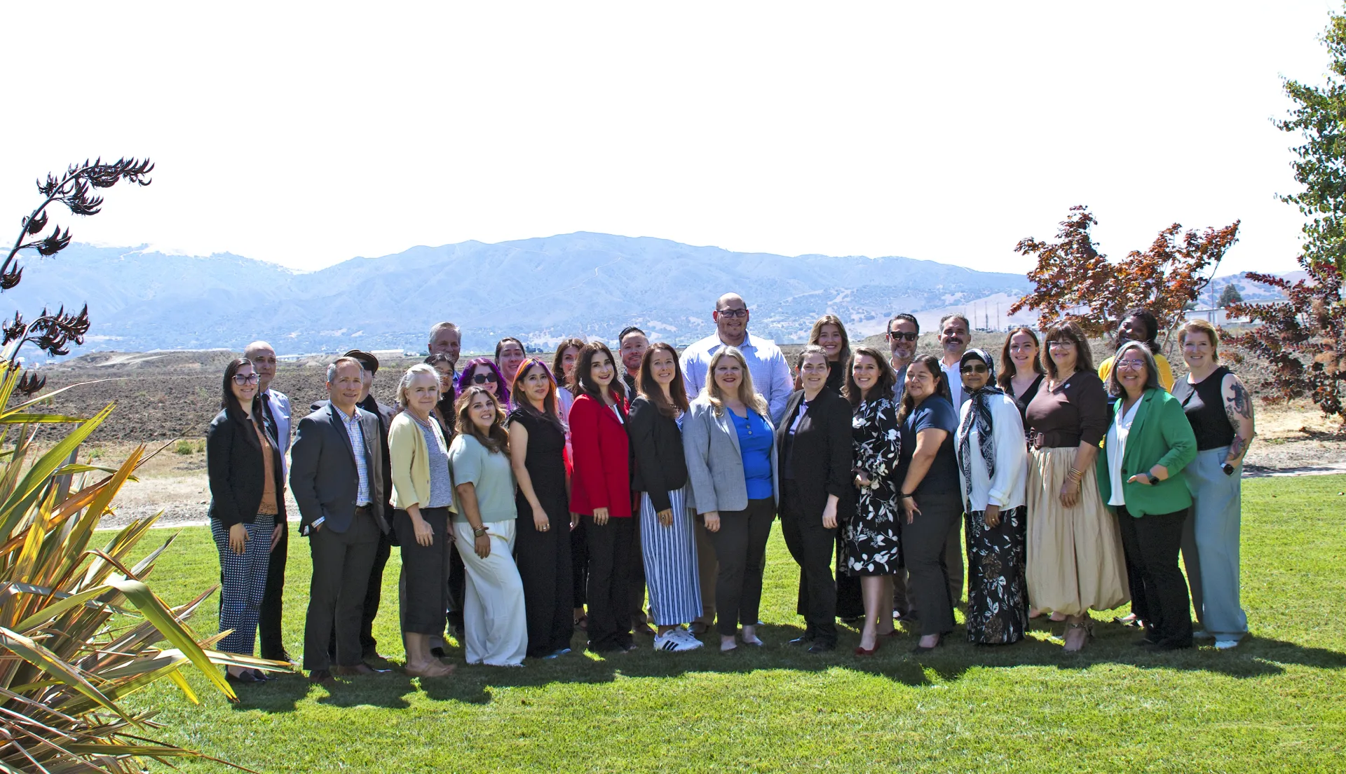 Large group standing on lawn