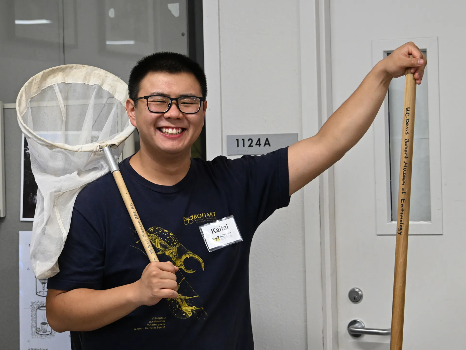 Kaitai Liu, a first-year doctoral student in the Jason Bond lab, with an insect net. (Photo by Kathy Keatley Garvey)