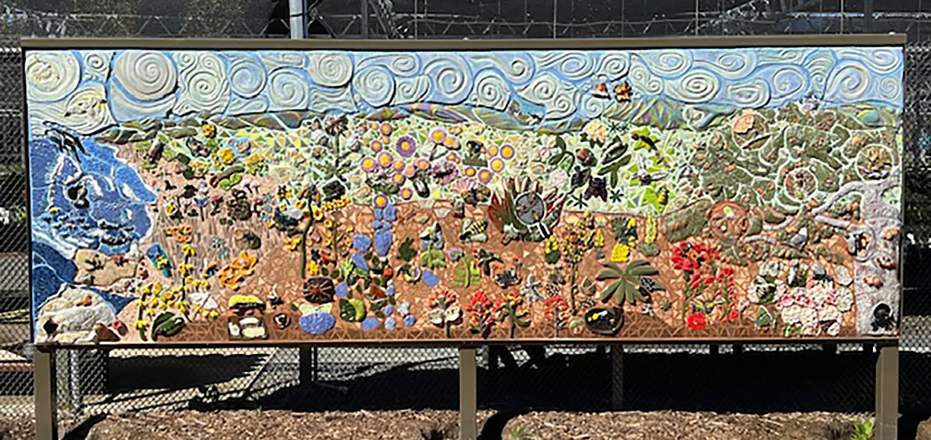 A newly installed ceramic-mosaic mural near the UC Davis Arboretum and Public Garden's Plant Nursery. It is the work of UC Davis entomology students taught by Emily Meineke and Diane Ullman of the Department of Entomology and Nematology. Three more murals will be located next to it. (Photo by Diane Ullman)