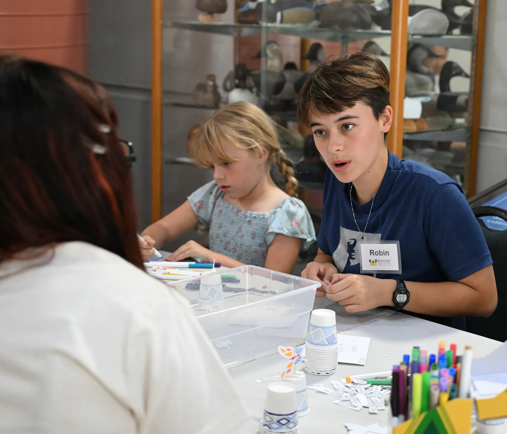 UC Davis student Robin Keil, who is majoring in biochemistry and minoring in entomology, staffing the arts-and-crafts table. (Photo by Kathy Keatley Garvey)