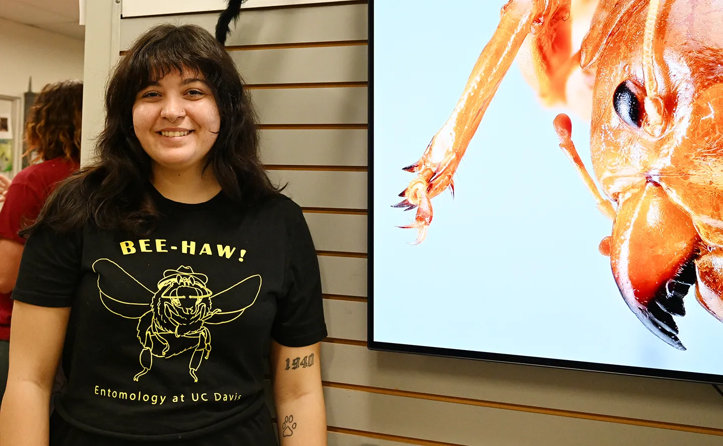 UC Davis doctoral candidate Lexie Martin wearing a "Bee-Yaw" T-shirt designe by a member of the UC Davis Entomology Graduate Student Association. (Photo by Kathy Keatley Garvey)
