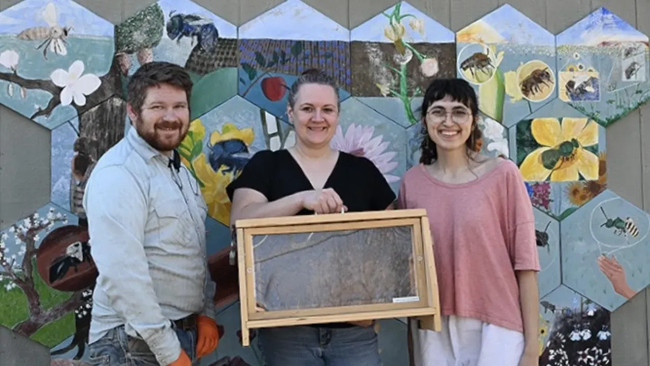 The UC Davis Bee Team includes (from left) Joseph Tauzer, manager of the Harry H. Laidlaw Jr. Honey Bee Research Facility; bee scientist Elina Nino, professor of UC Cooperative Extension, Apiculture, and head of the Nino lab, UC Davis Department of Entomology and Nematology; and Samantha Murray, education and garden coordinator of the UC Davis Bee Haven. (Photo by Kathy Keatley Garvey)