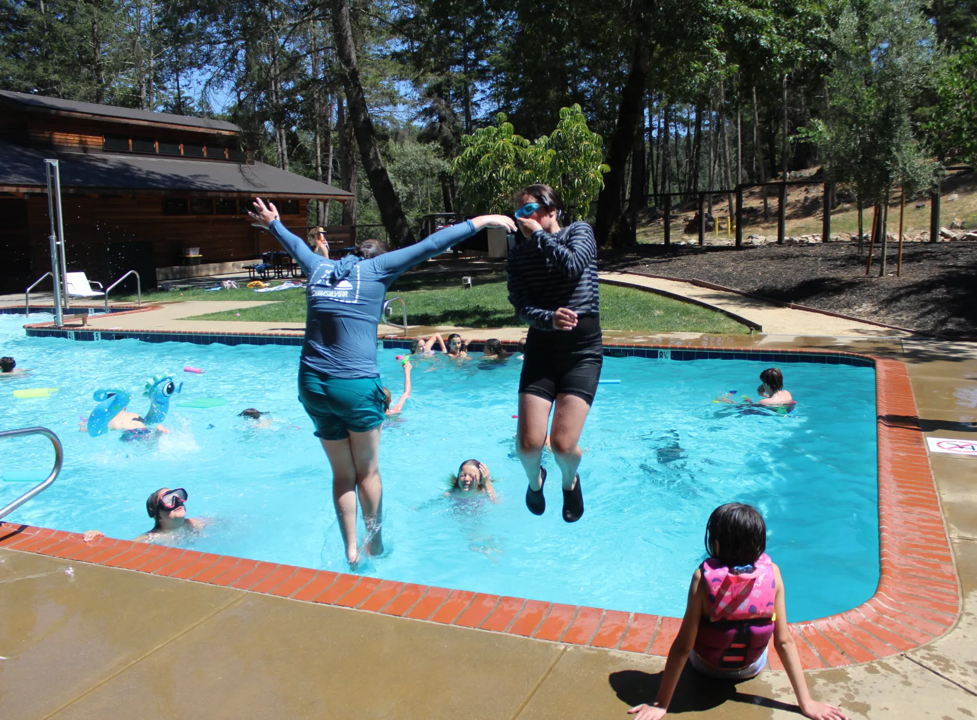Youth swimming at 4-H Summer Camp.