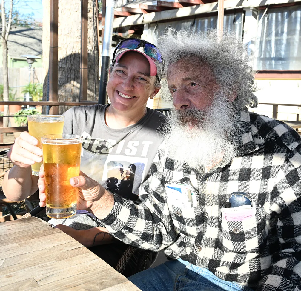 Herpetologist Kat Calderala and lepidopterist Art Shapiro, co-winners of the Beer-for-a-Butterfly Contest, celebrate the victory. (Photo by Kathy Keatley Garvey)