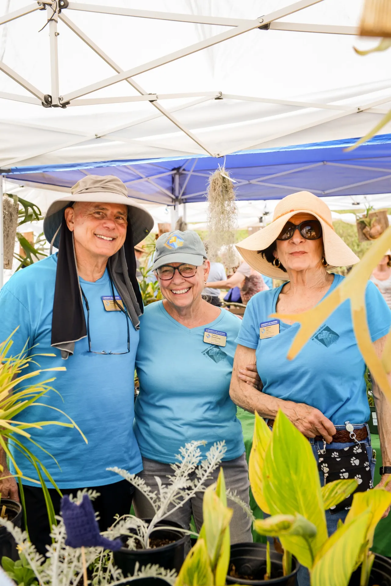 Three happy Master Gardener women smiling
