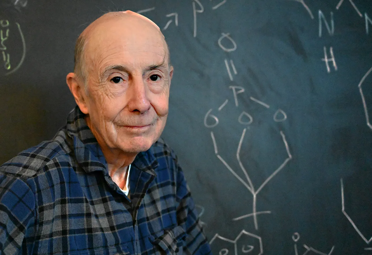 Bruce Hammock in front of a blackboard. (Photo by Kathy Keatley Garvey)