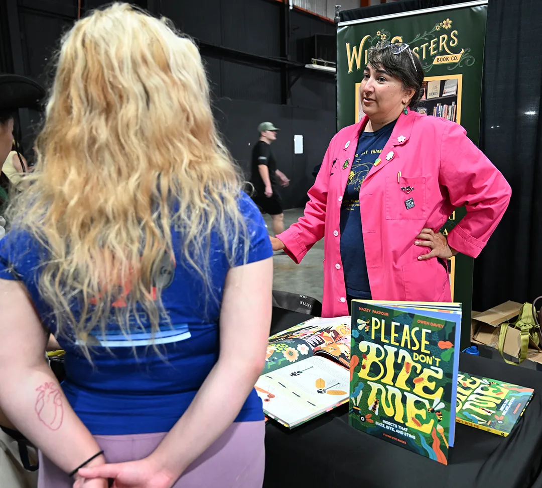 Nazzy Pakpour speaking in her booth at the 2025 California Honey Festival