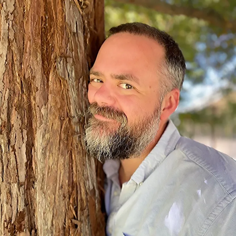 Sean Leonard by a tree