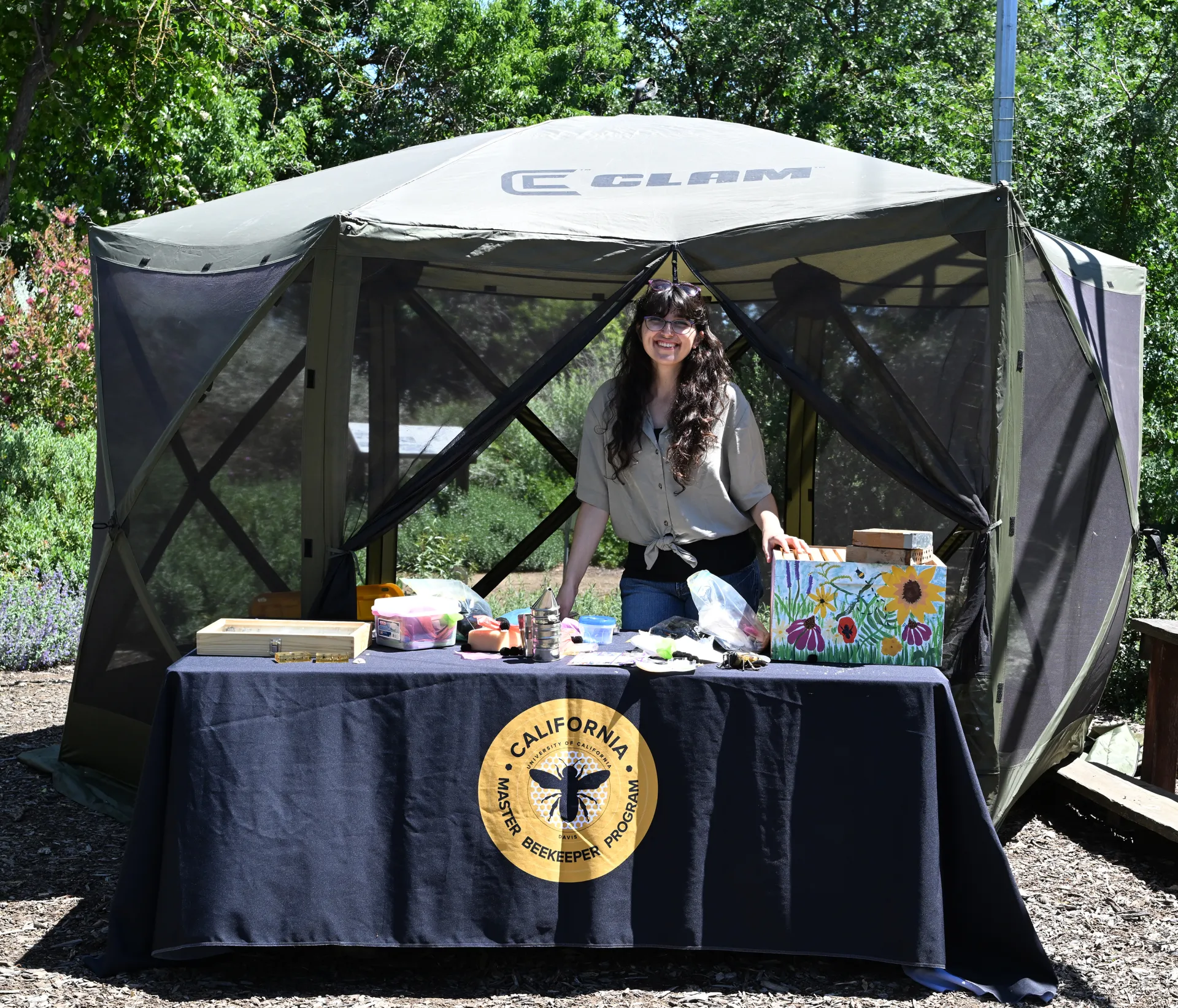 Samantha "Sam" Murray ready to greet visitors and talk about bees and other pollinators.