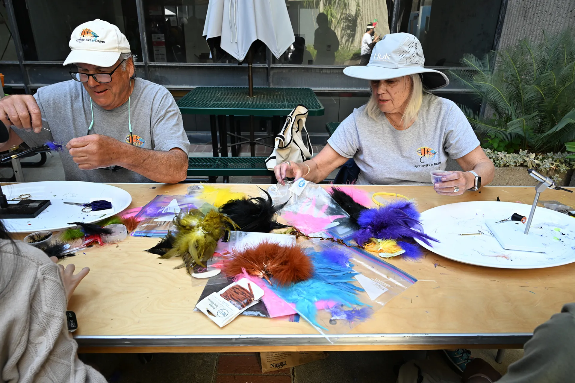 Marc Wilson and Marianne Lewis of the Fly Fishers of Davis demonstrating how to tie a fly.