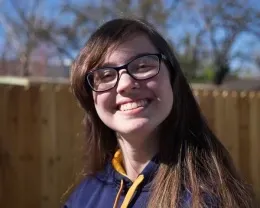 Youth smiling with low side light