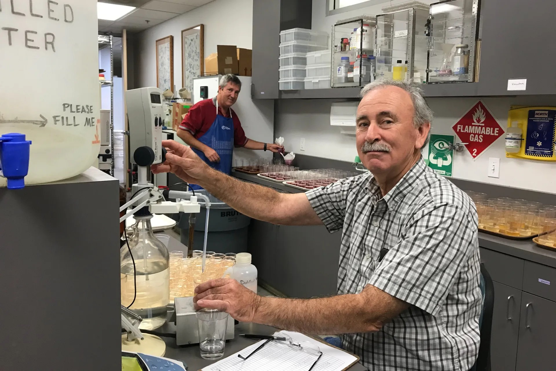 Larry Bettiga (right) works in a lab with technician Evan Oaks