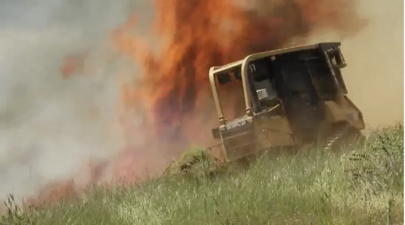 Bouldozer at fire line