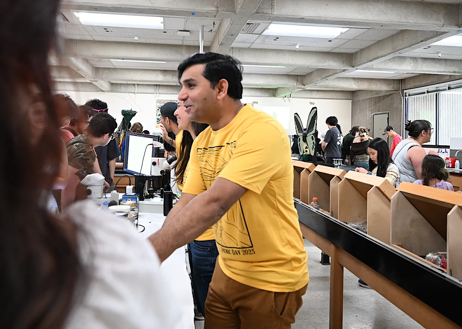 UC Davis nematologist Shahid Siddique answering questions at a UC Davis Picnic Day celebration.