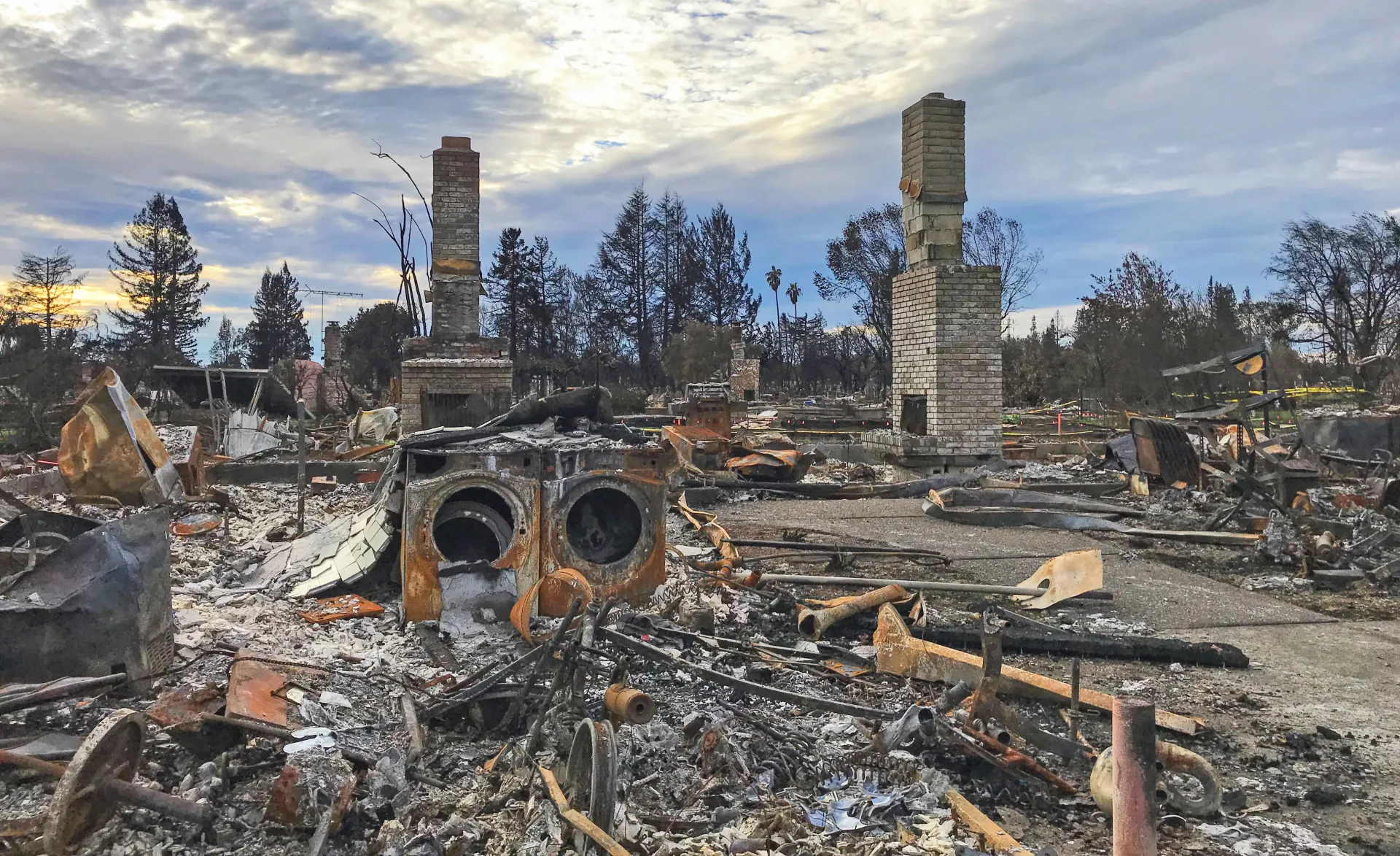 Image with wildfire damages to a house in the wildland-urban interface.