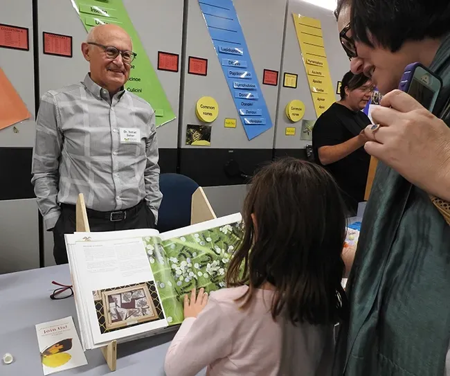  Dr. Ismail Seker, an expert on silkmoths, talks to the Bohart Museum crowd at the 2019 Moth Night.