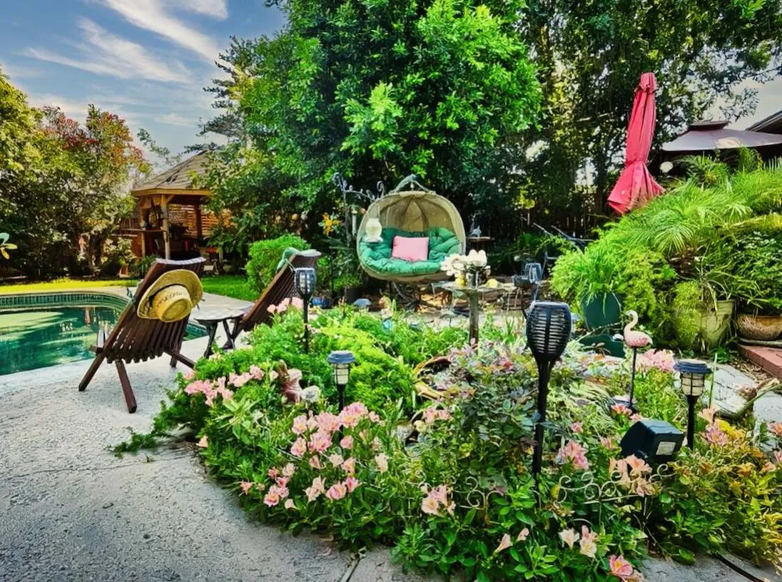a view of a backyard with lots of flowers