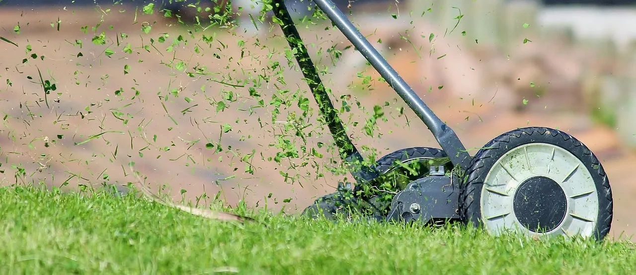lawn mower kicking up clippings