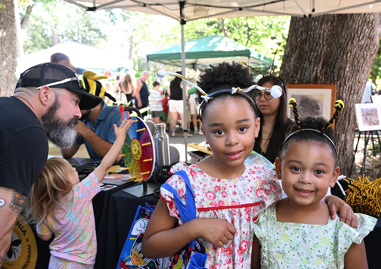 Sisters Audrina Lockett, 7 and Ava Lockett, 5, show their new bee antennae headbands.