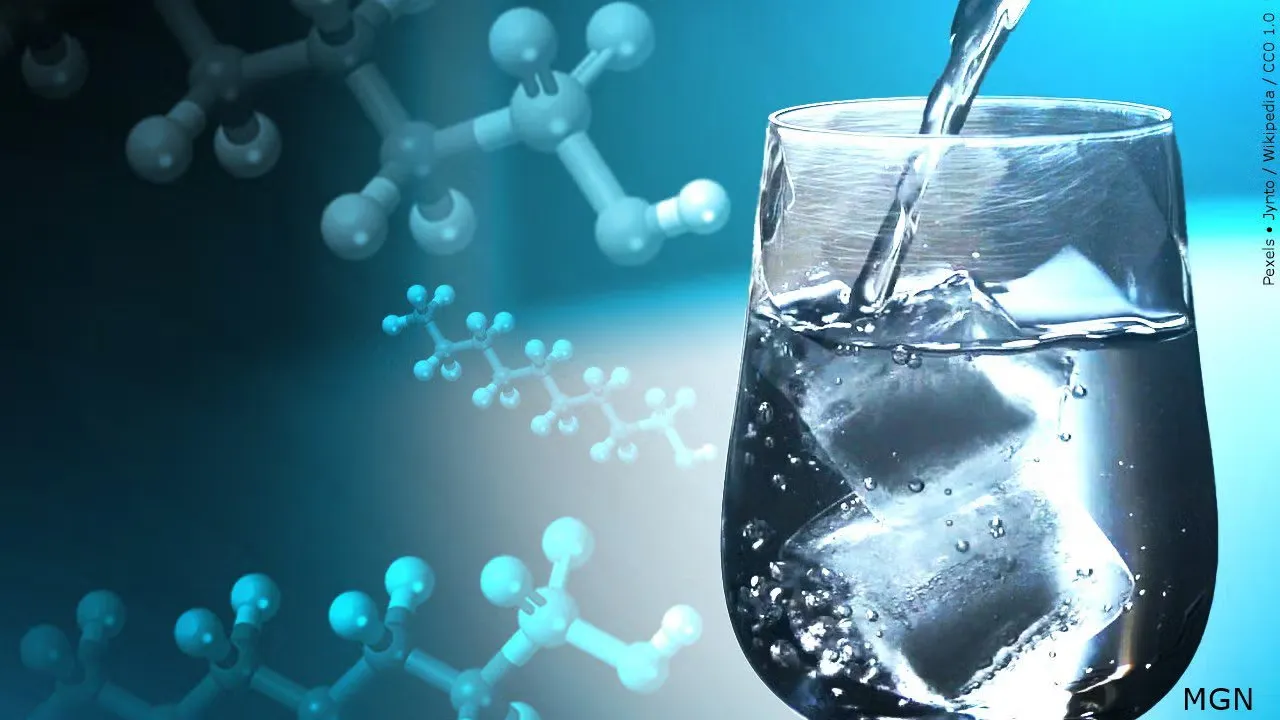 Photo of water being poured into a glass with ice, with chemical molecules floating in the background.