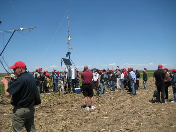 Tour participants gather around the $55,000 evapotranspiration research equipment.