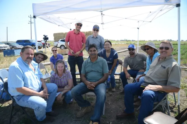 The CASI group working on pivot irrigation in tomato fields in Walnut Grove.