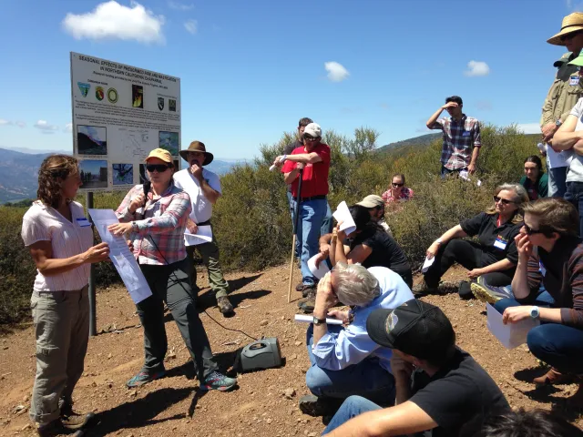 Kate Wilkin and Jen Potts explaining graphic to group