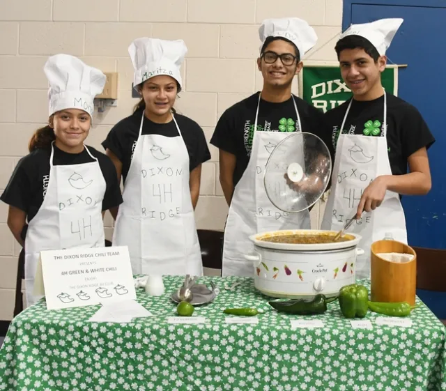 This is the championship Dixon Ridge 4-H Club Chili Team: (from left) siblings Moncerral “Monce” Torres Cisneros, Maritzia Partida Cisneros, Rudolfo “Rudy” Radillio Cisneros, and Miguel Partida Cisneros. They made “4-H Green and White Chili.” (Photo by Kathy Keatley Garvey)