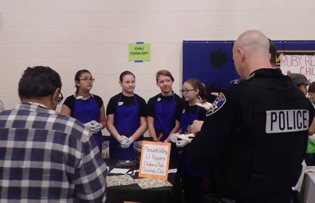 Pleasants Valley 4-H'ers of Vacaville--(from left) Maliyah Desmarais, Maya Farris, Naomi Lipary and Jessie Means-- answer questions from Solano County Board of Supervisor John Vasquez Jr. (front left) and Vacaville police officer Steve Moore. (Photo by Kathy Keatley Garvey)