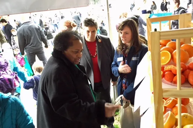 Assemblymember Shirley Weber, left, listens as Glenda Humiston and Anne Megaro explain ANR's research on citrus and avocado varieties.
