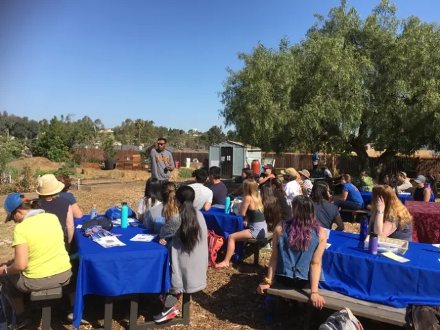 Paul Watson, President and CEO of the Global Action Research Center, introduces the Ocean View Growing Gardens to GFI fellows. “Not only do we apply the latest environmental research through our partnership with UCSD, but we've worked closely with community leaders and learned how to use food as a organizing tool in this neighborhood,” Watson said.